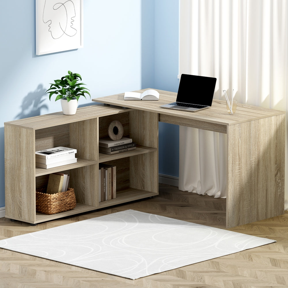 The Apex Adaptive L-shaped corner desk in light oak with white storage drawers, styled in a modern urban home office.