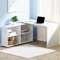 The Apex Adaptive L-shaped corner desk in light oak with white storage drawers, styled in a modern urban home office.